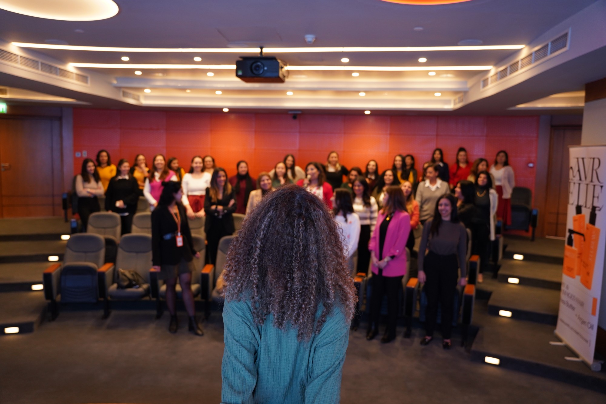 Nourhan Maher speaking to a group of women at a workshop