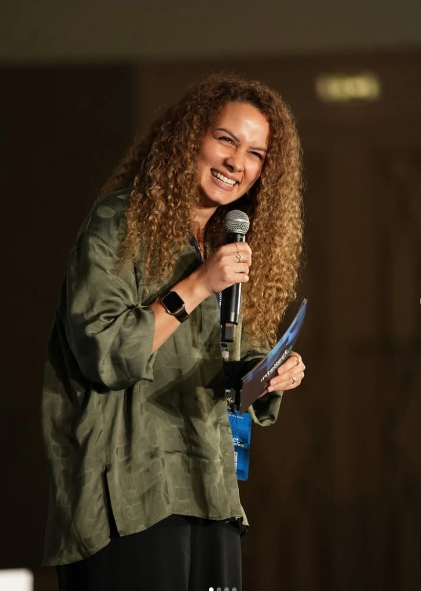 Nourhan Maher speaking on stage at Intellect Conference
