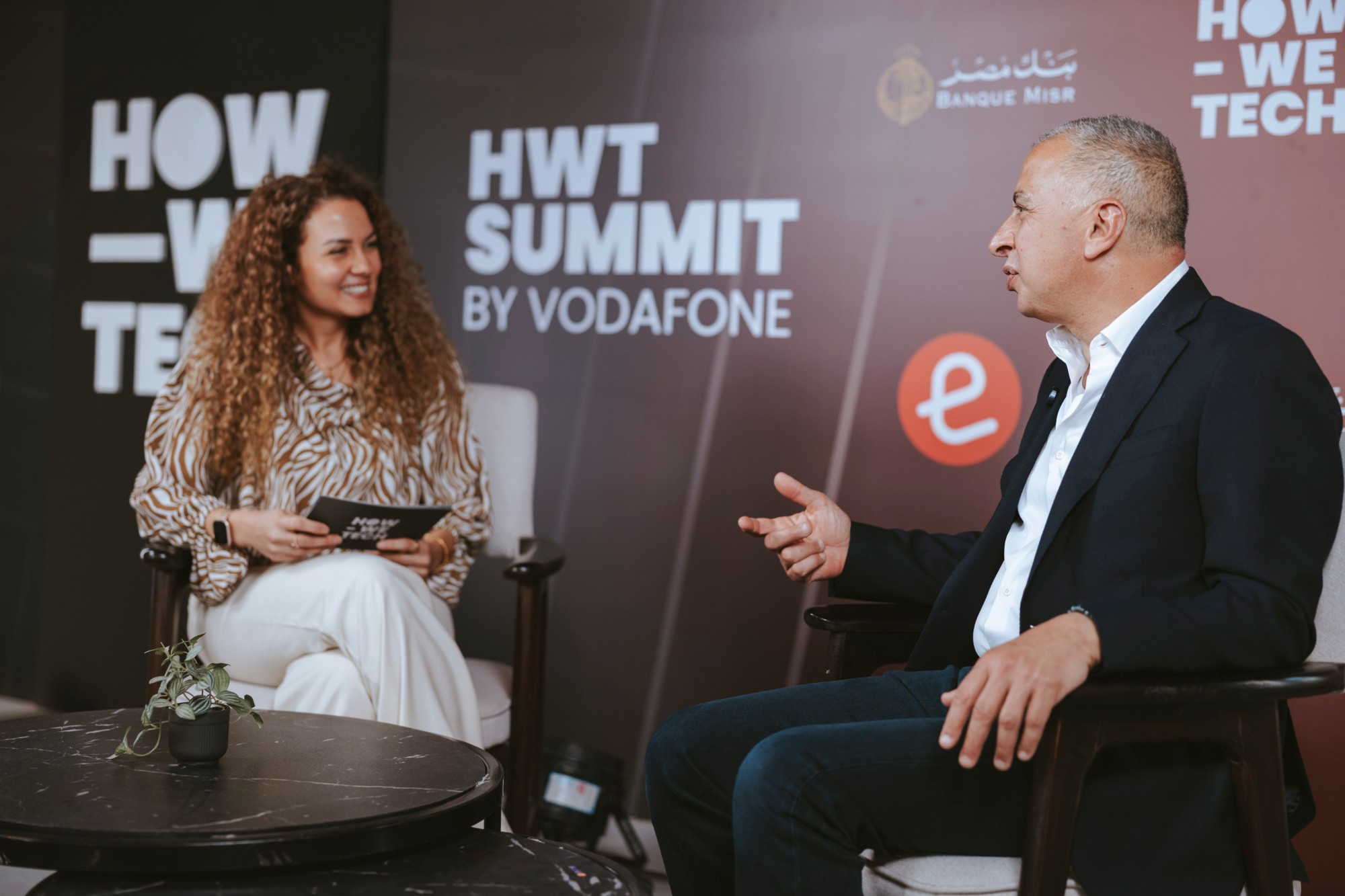 Nourhan Maher hosting an interview on stage at the HWT Summit by Vodafone